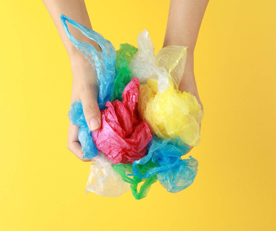 hands clutching plastic carrier bags